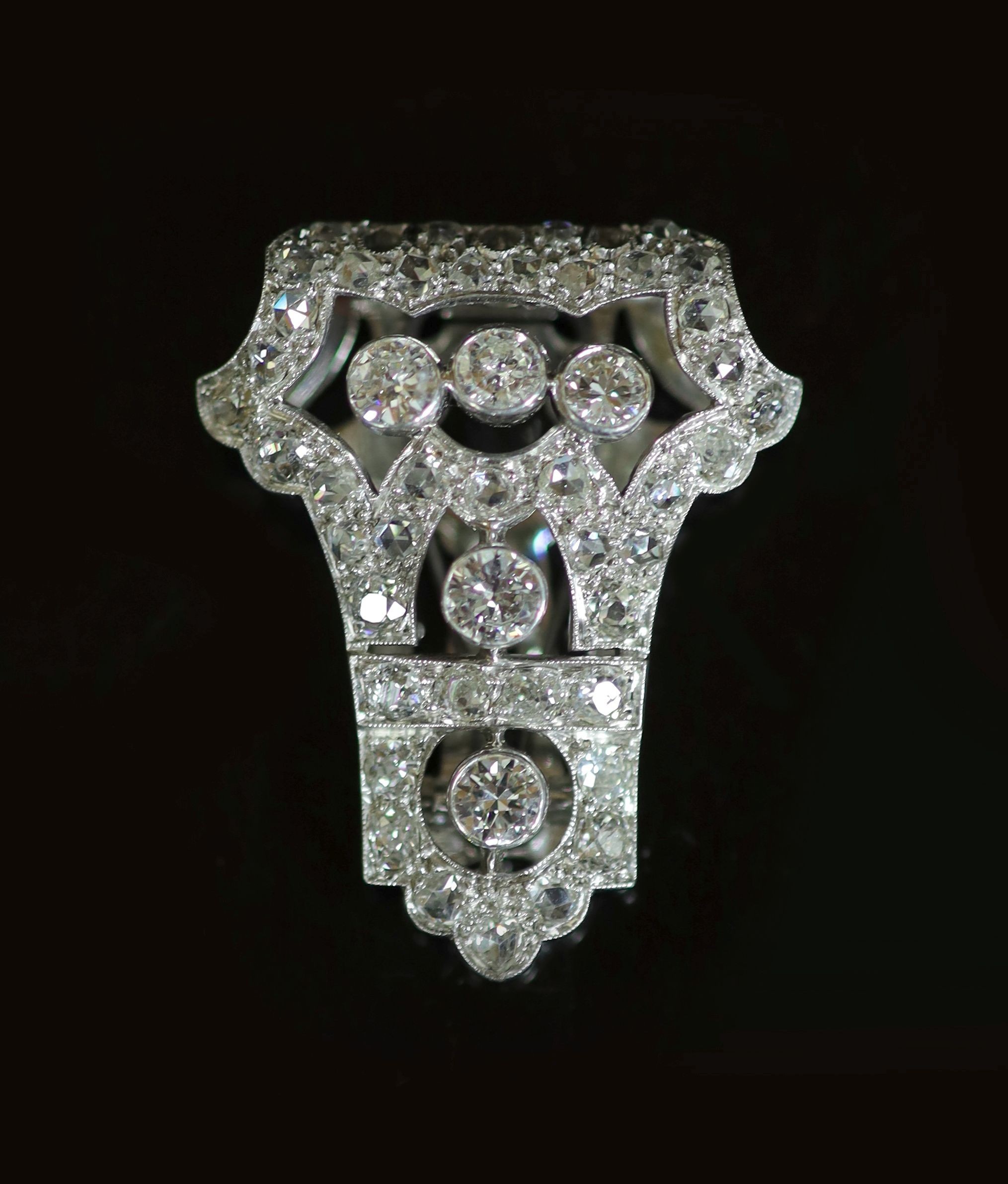 A 1920's/1930's Art Deco pierced platinum and diamond clip brooch